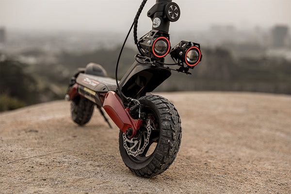 Advantages of double shock-absorbing off-road electric scooter riding on gravel